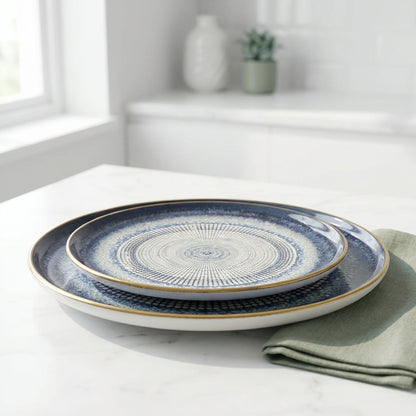 Set of blue and white ceramic plates on a marble surface with a light background