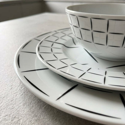Ceramic dishes with geometric pattern on a kitchen counter