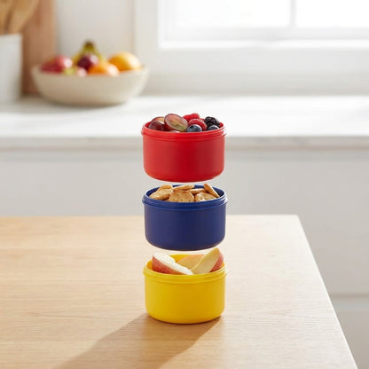 Stackable containers with snacks on a kitchen counter