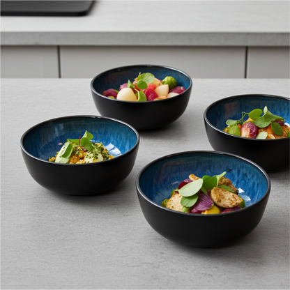 Four blue bowls with food on a gray surface