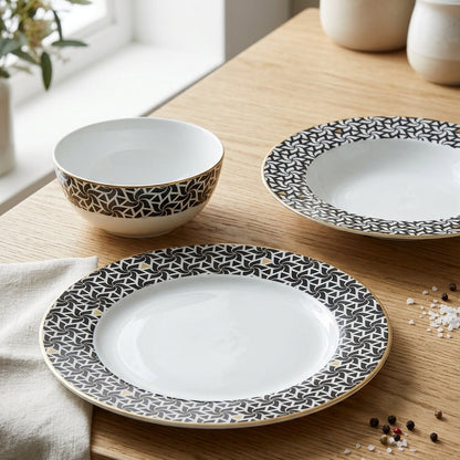 Dishes with black geometric patterns on a wooden table