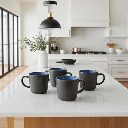 Black mugs with blue interior on a kitchen counter