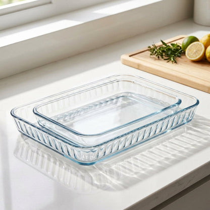 Clear glass baking dish on a kitchen counter with a window in the background