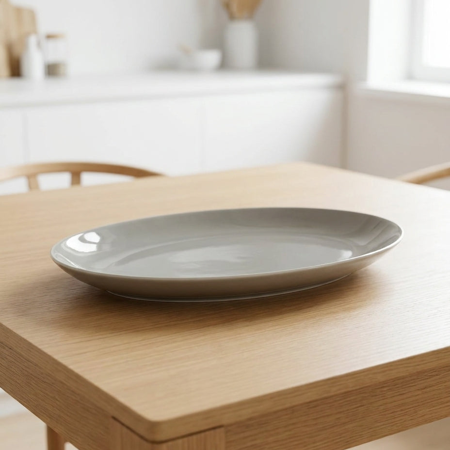 Gray ceramic plate on a wooden table with a blurred background