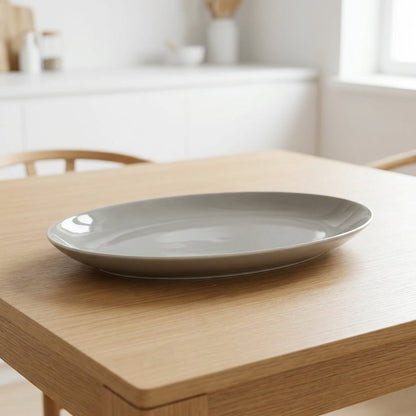 Gray ceramic plate on a wooden table with a blurred background