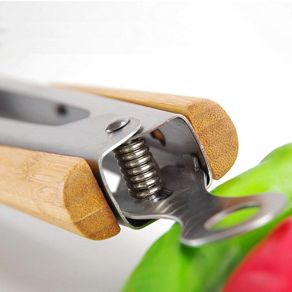 Close-up of a kitchen tool with wooden handle and metal mechanism, with a blurred background.