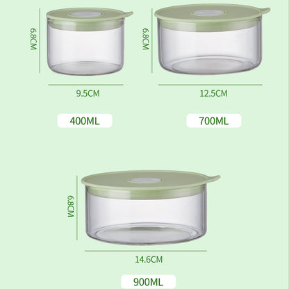 Three clear containers with green lids and measurements on a light green background