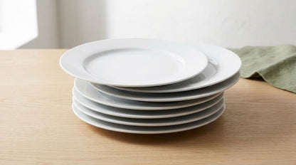 Stack of six white 19 cm plates